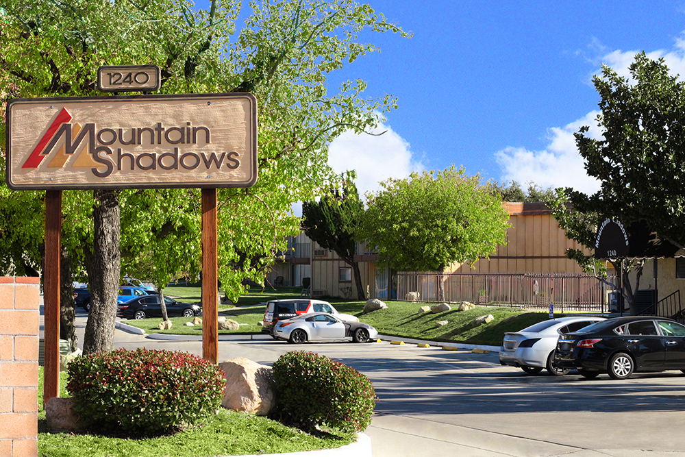 This image displays entrance marker photo of Mountain Shadows Apartments