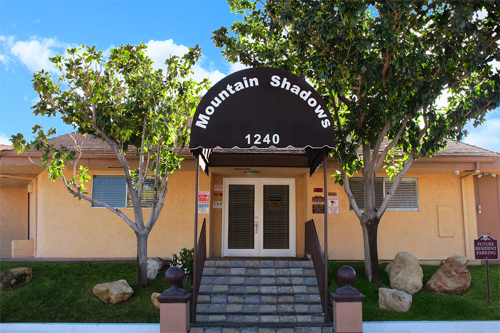 This image displays entrance photo of Mountain Shadows Apartments