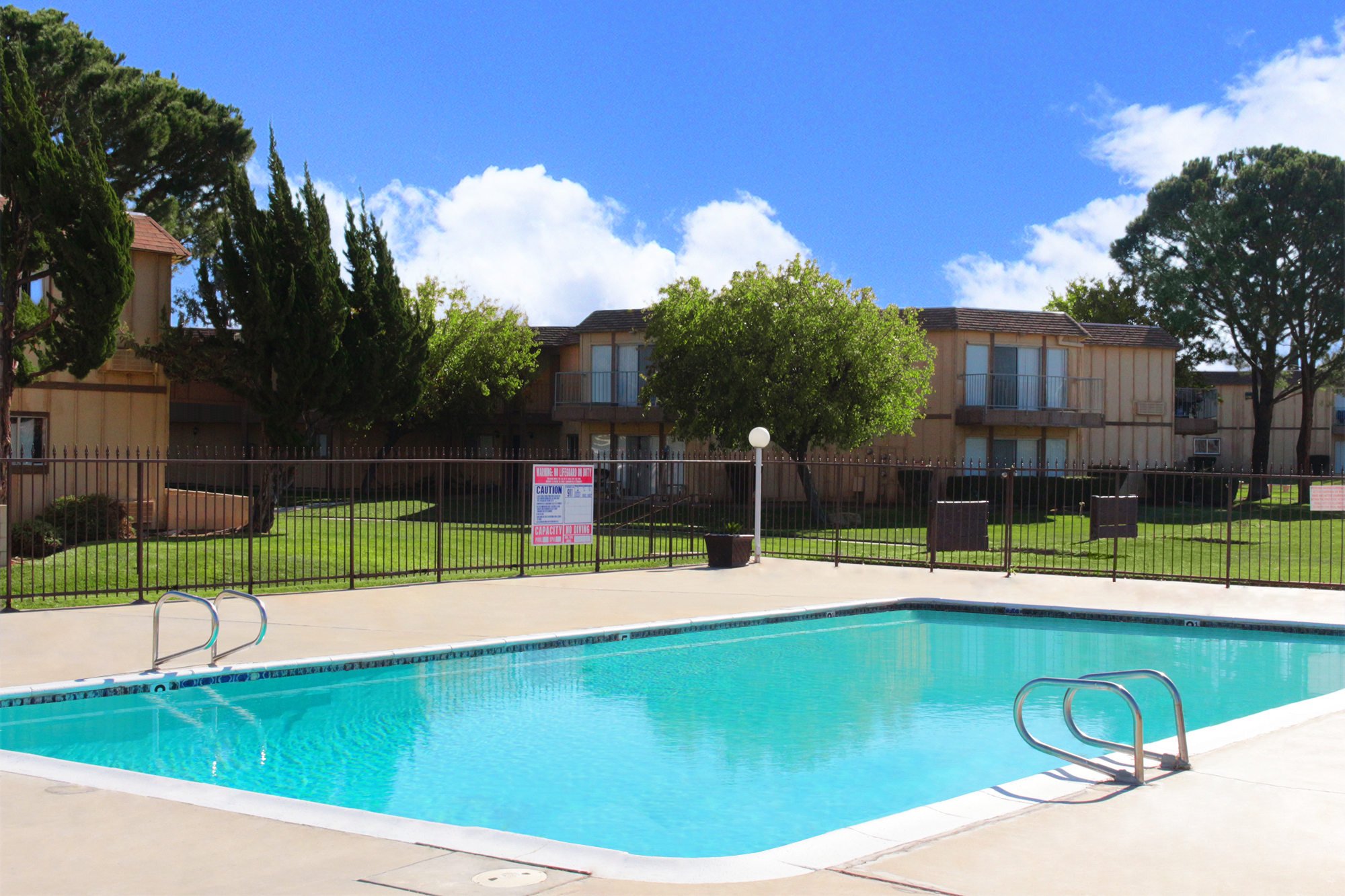 This banner image shows the swimming pool of Mountain Shadows Apartments.